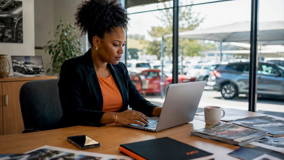 Marketer setting up Google Ads at car dealership